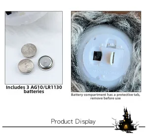 Detail view of the gnome ornament battery box with 3 AG10 button cells and power switch