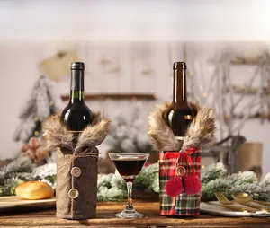 Detail of Christmas wine bottle covers with faux fur collars and festive patterns