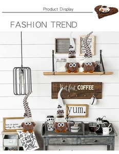 Close-up of owl coffee gnomes with plush brown fur and coffee bean accents for home decor