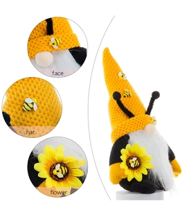 Macro detail of bee gnome hat, fuzzy beard, and sunflower accessory details