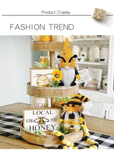 Detailed view of bee gnomes with sunflowers on a rustic tiered tray for home decor