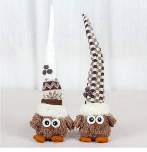 Detail of owl plush dolls featuring knitted long hats and coffee bean decorations