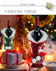 Detailed view of red and green knitted Christmas wine bottle covers with reindeer patterns