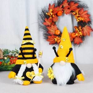 Bee festival gnome set with knitted striped hats and sunflowers on a rustic background