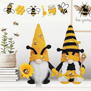 Pair of bumble bee gnome plush figurines with sunflower and honey wand decor
