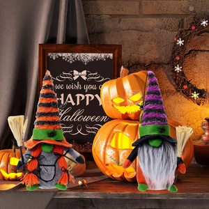 Handcrafted Halloween plush gnomes set with striped hats and brooms on wooden table