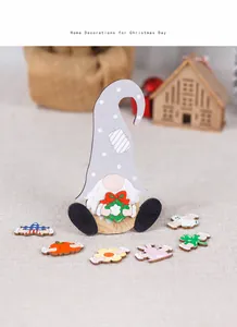 Detail of wooden gnome figurine with interchangeable seasonal accessories for tabletop decor