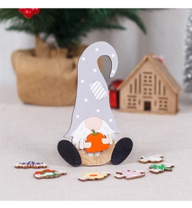 Close-up of wooden gnome decor set with interchangeable seasonal pumpkin and clover icons