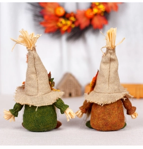 Close-up of harvest gnome set with burlap details and maple leaf accents for autumn decor