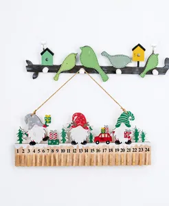 Detail of wooden Christmas gnome advent calendar with 24 clips for holiday countdown