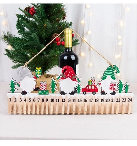 Detail of wooden Christmas gnome advent calendar with 24 clips for holiday countdown
