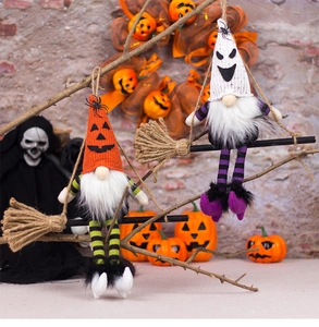 Detailed view of handmade Halloween gnome plushies on brooms with pumpkin and ghost hat designs