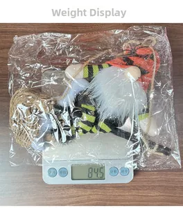 Weight measurement of a plush Halloween gnome with striped hat and white beard decoration