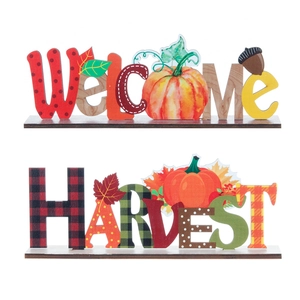 Wooden harvest welcome signs set with pumpkin and maple leaf motifs for autumn tabletop decor