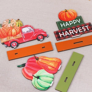 Wooden harvest festival table decor set with red truck and pumpkins for autumn theme