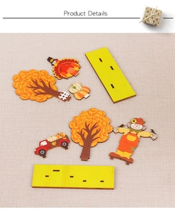 Détail du décor d'automne en bois avec dinde, citrouilles et un petit camion rouge festif