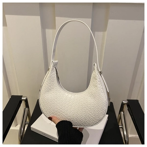 Detail of woven crescent shoulder bag showing white braided texture and zipper closure