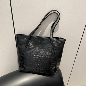 Fashionable black crocodile embossed leather tote bag with spacious interior and slim straps