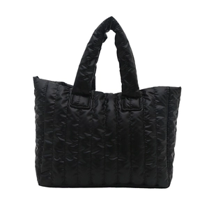 Minimalist black quilted puffer tote bag with glossy finish and large capacity