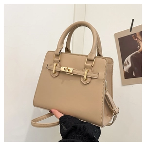 Detailed close-up of beige PU leather handbag with golden twist lock and Kelly buckle