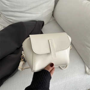 Retro cream white crossbody bag with gold hardware and stylish minimalist design