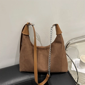 Brown woven hobo tote bag with leather trim and silver metal chain detail for women