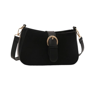 Minimalist black underarm bag with matte leather panels and a large gold metal buckle