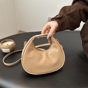 Retro cream crescent bag with crocodile pattern and golden hardware strap