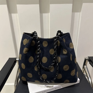 Navy blue polka dot felt tote bag with black chain straps for winter fashion