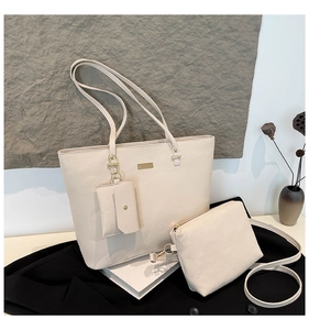 Three-piece beige tote bag set featuring pebbled leather and a zip pouch for work