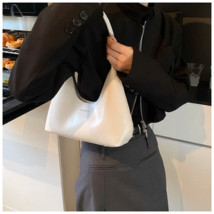 Detail of white hobo crescent bag with silver zipper and JIASHIQING logo on leather