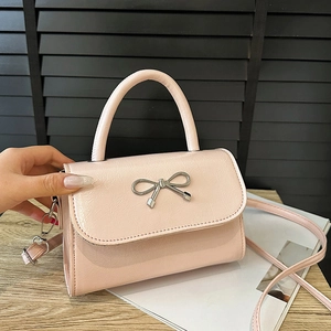 Chic pink bow small crossbody bag in glossy PU leather with silver metal hardware