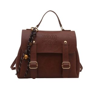 Vintage dark brown faux leather backpack for women with buckle straps and charm