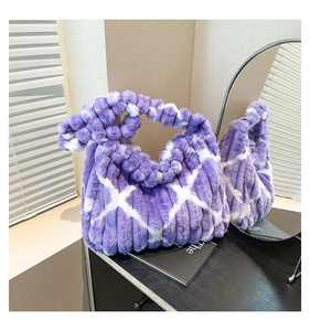 Macro detail of plush faux fur shoulder bag with purple stripes and bead handle