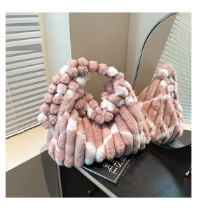 Detailed macro view of high-quality pink and white faux fur texture on a tote bag