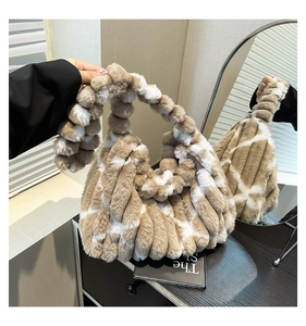 Detail shot of the plush faux fur shoulder bag with brown and white leopard spots