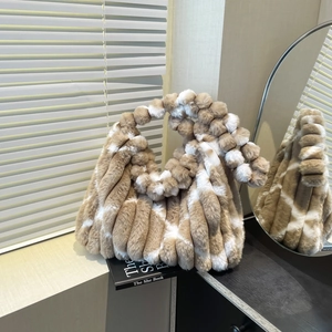 Chic camel and white striped faux fur tote bag with plush pom-pom handle for autumn style
