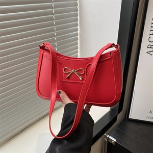 Fashionable red crescent shoulder bag with golden bow decoration for women