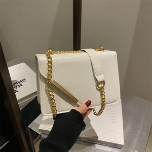 Elegant white PU leather flap crossbody bag with gold chain strap and metal bar detail