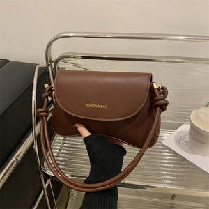 Retro dark brown leather shoulder bag with a stylish thick rope knot strap and gold logo
