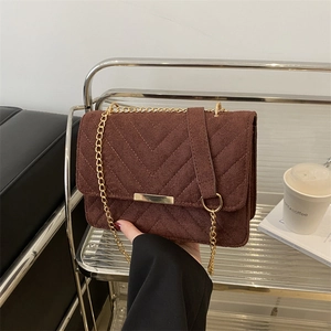 Brown suede chain shoulder bag with V-shaped quilting and gold metal strap