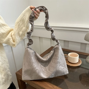 Modern pleated cloud bag with marble texture pattern and elegant shoulder strap