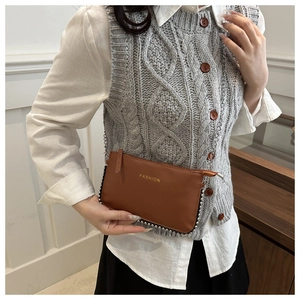 Brown faux leather crossbody bag with FASHION lettering and metallic bead trim detail