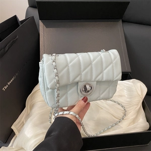Quilted light blue chain crossbody square bag with elegant silver ring clasp