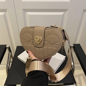 Quilted heart-shaped crossbody bag in beige leather with wide adjustable strap