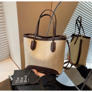 Detailed close-up of retro beige and brown stitching tote bag with textured synthetic leather