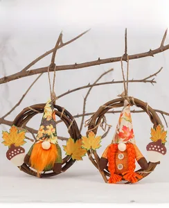 Close-up of handmade Thanksgiving rattan wreaths featuring autumn gnomes and maple leaves