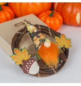 Macro detail of Autumn Harvest Wreath featuring a cute gnome and colorful maple leaves