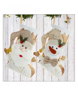 Detail of 3D Santa and Snowman Christmas stockings in cream and champagne gold knit