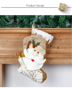 Detail of a white faux fur and gold sequin Christmas stocking with 3D Santa Claus figure